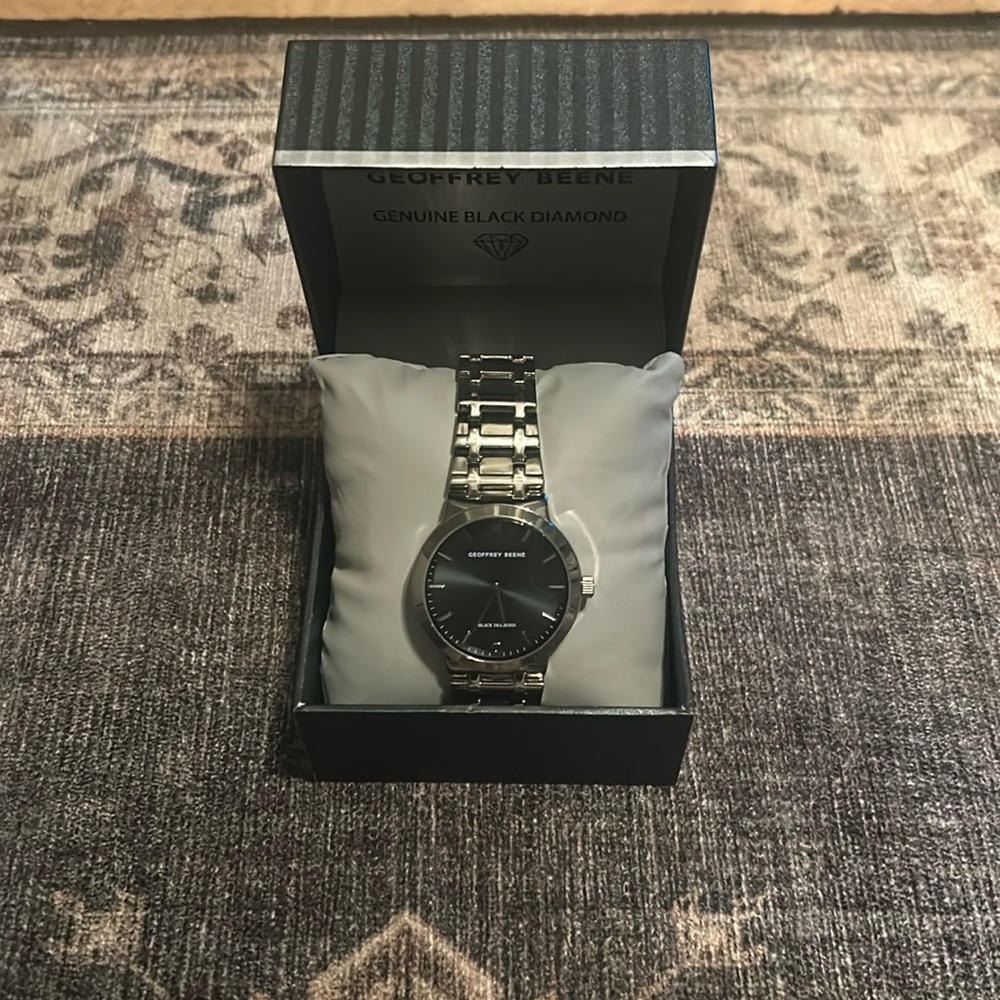 A a nice watch I got for a gift,Green face with stainless steel everywhere else.
